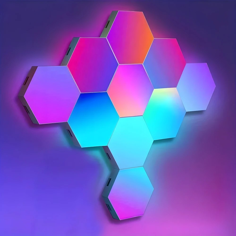 Close-up of RGB hexagon LED light panels showing vibrant gradient from hot pink to orange to purple to cyan with visible connectors